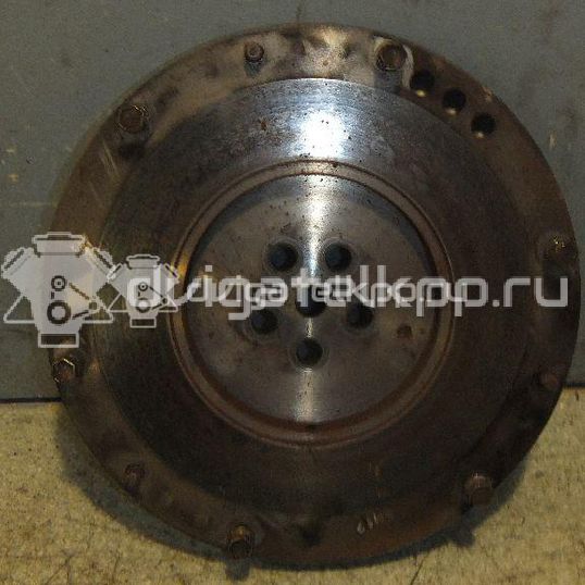 Фото Маховик для двигателя G4ED для Hyundai (Beijing) / Hyundai / Kia 105-112 л.с 16V 1.6 л бензин 2320026101