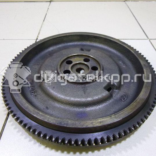 Фото Маховик для двигателя G4EE для Hyundai (Beijing) / Kia 95 л.с 16V 1.4 л бензин 2320026101