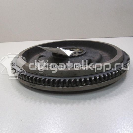 Фото Маховик для двигателя G4ED для Hyundai (Beijing) / Hyundai / Kia 105-112 л.с 16V 1.6 л бензин 2320026101
