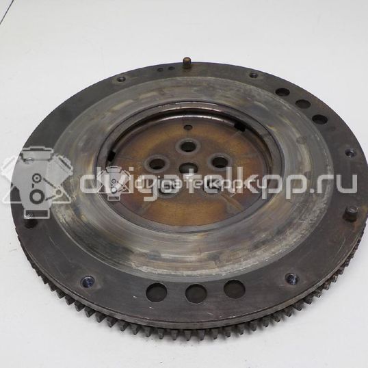 Фото Маховик для двигателя G4ED для Hyundai (Beijing) / Hyundai / Kia 105-112 л.с 16V 1.6 л бензин 2320026101