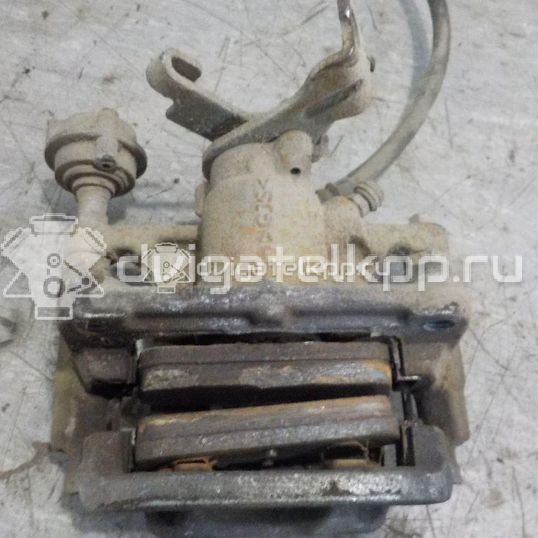 Фото Суппорт тормозной задний левый  13300863 для Chevrolet Cruze / Orlando J309 / Aveo / Volt