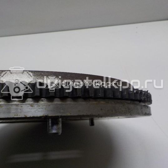 Фото Маховик для двигателя G4EE для Kia (Dyk) / Kia 95-97 л.с 16V 1.4 л бензин 2320026101