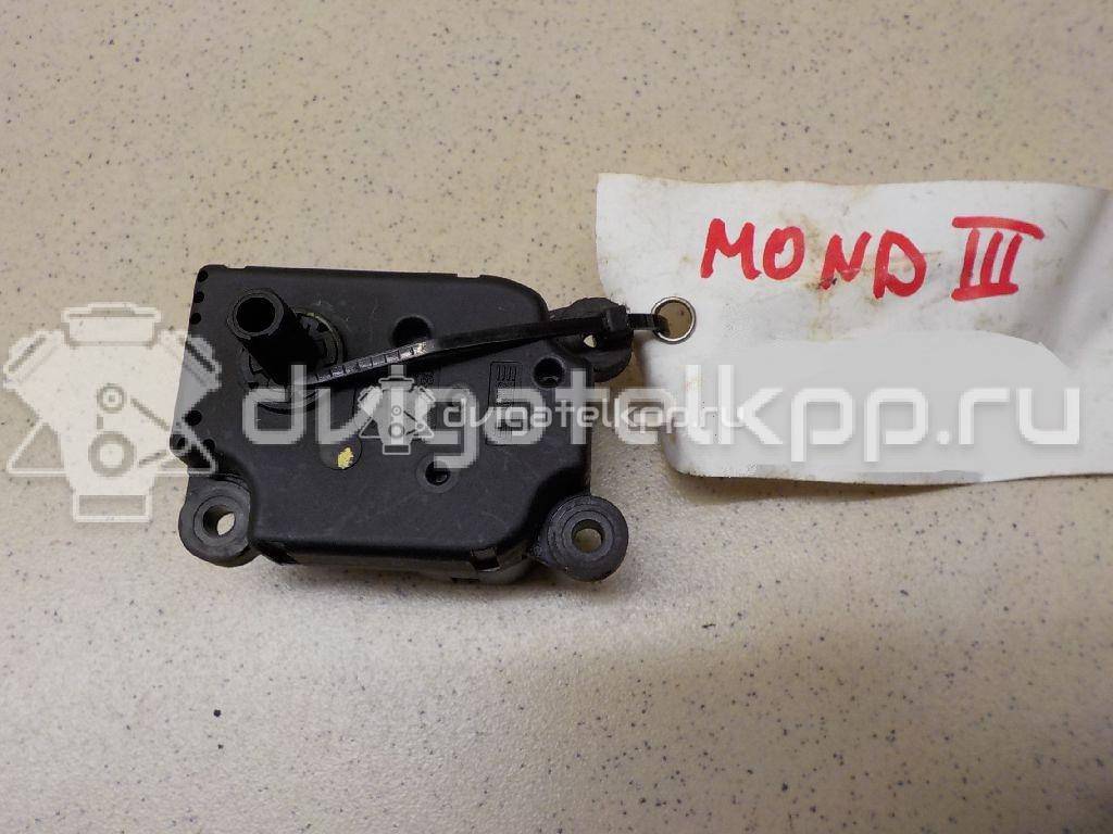 Фото Моторчик заслонки отопителя  1S7H19E616AA для Ford Focus / Mondeo {forloop.counter}}
