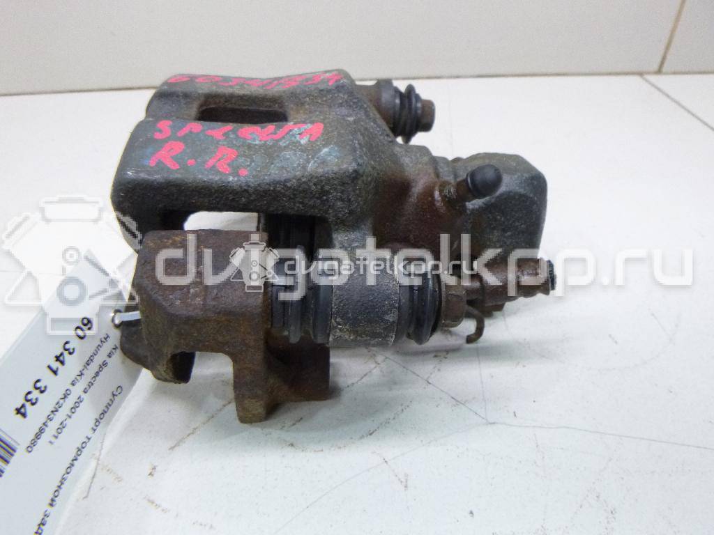 Фото Суппорт тормозной задний правый  0K2N349980 для Kia Shuma Fb / Carens / Sephia Fa / Clarus {forloop.counter}}