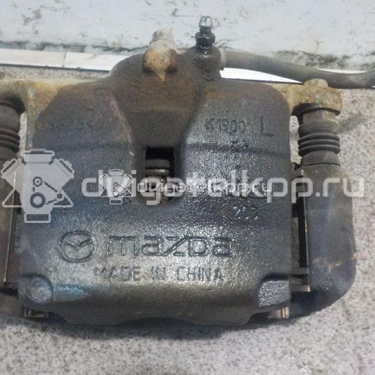 Фото Суппорт тормозной передний левый  B4Y03399ZB для Mazda Cx-3 Dk / 3