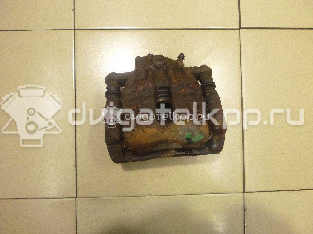 Фото Суппорт тормозной передний левый  41011AX60A для Nissan Note / Micra {forloop.counter}}