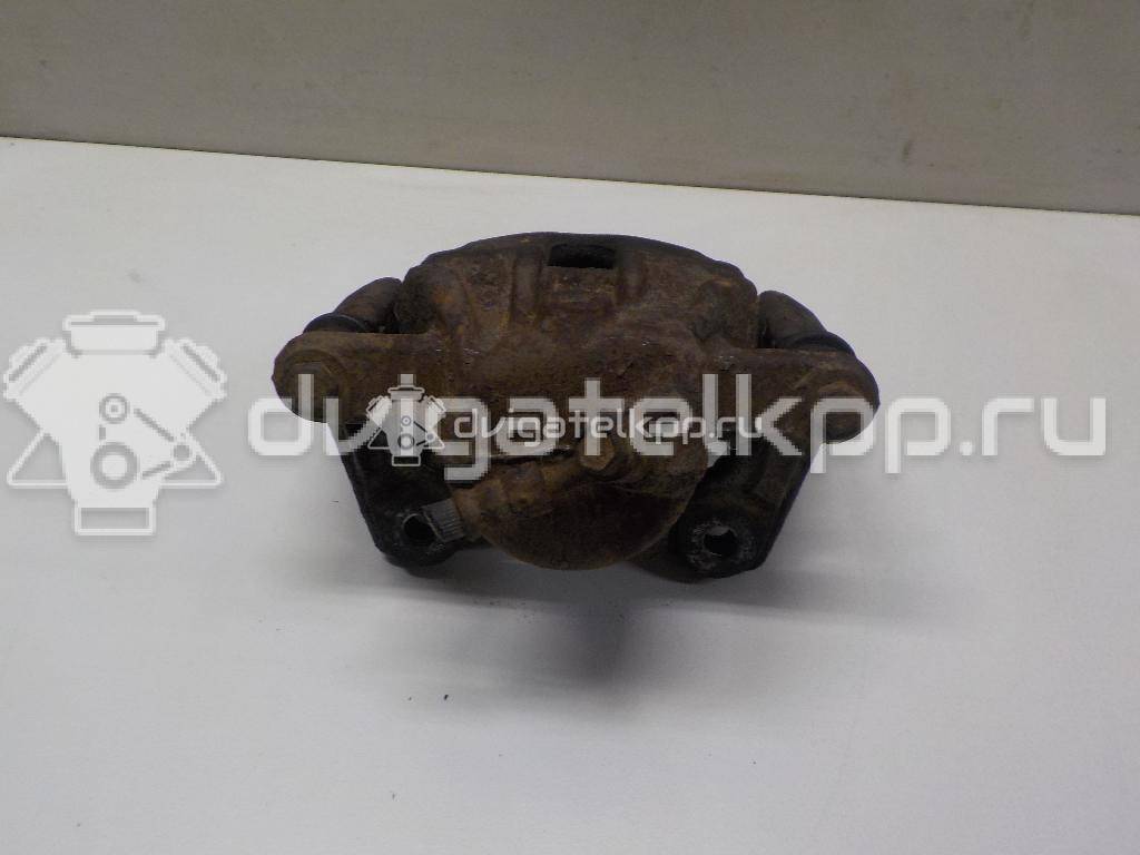 Фото Суппорт тормозной передний левый  41011AX60A для Nissan Note / Micra {forloop.counter}}