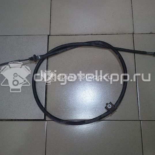 Фото Трос стояночного тормоза левый  36531AX601 для Nissan Micra