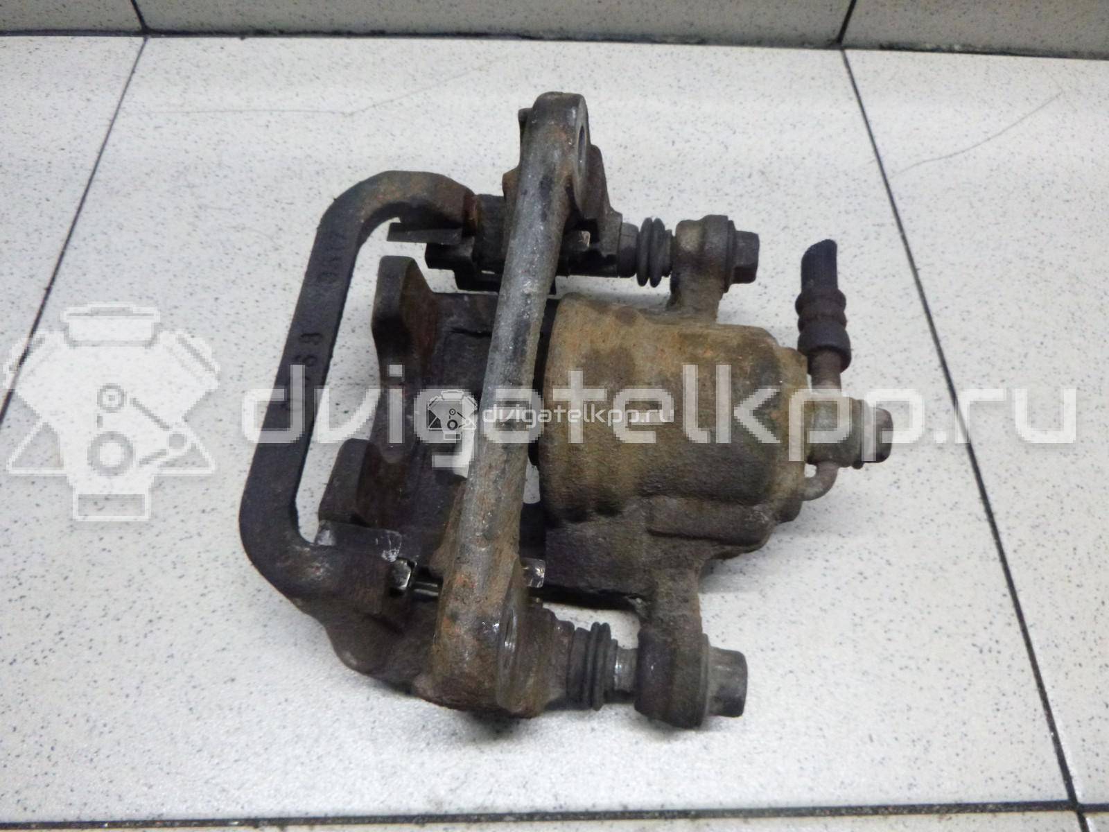Фото Суппорт тормозной задний правый  44001EM11A для Nissan Tiida / Qashqai / Cube Z12 / Juke F15 / Pulsar C13 {forloop.counter}}
