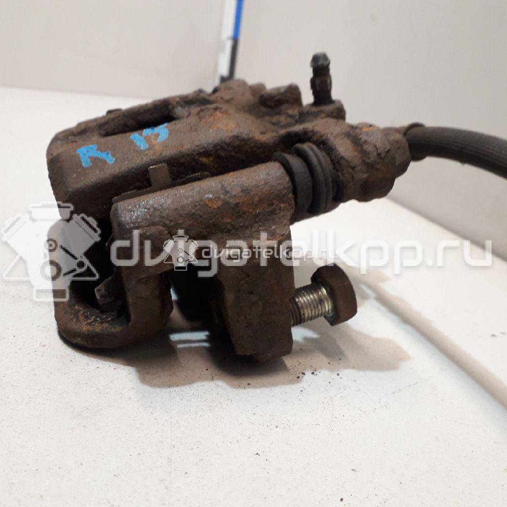 Фото Суппорт тормозной задний правый  44001EM11A для Nissan Tiida / Qashqai / Cube Z12 / Juke F15 / Pulsar C13 {forloop.counter}}