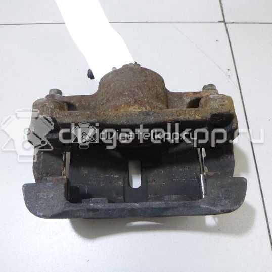 Фото Суппорт тормозной передний левый  410114EA0A для Nissan Qashqai