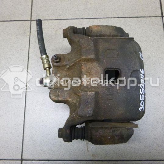 Фото Суппорт тормозной передний левый  410119Y00A для Nissan Teana