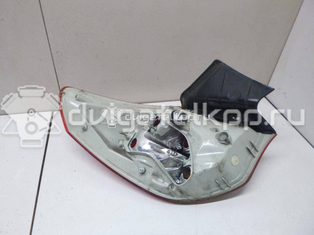 Фото Фонарь задний наружный правый  13306454 для Opel Astra {forloop.counter}}