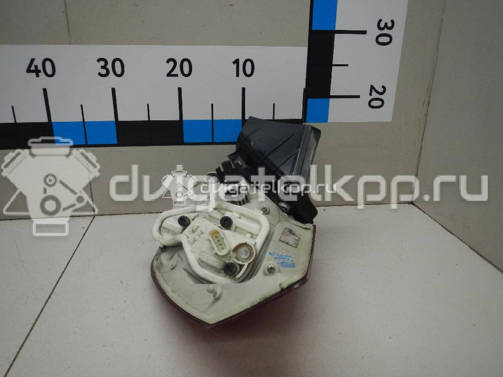 Фото Фонарь задний наружный левый  13306453 для Opel Astra {forloop.counter}}