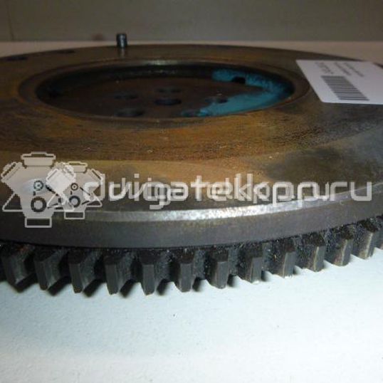 Фото Маховик для двигателя G4EE для Kia Rio / Pride 97 л.с 16V 1.4 л бензин 2320026101
