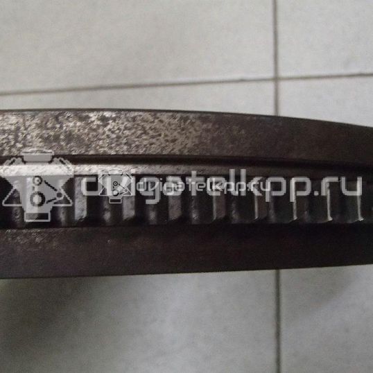 Фото Маховик для двигателя G4EE для Kia Rio / Pride 97 л.с 16V 1.4 л бензин 2320026101