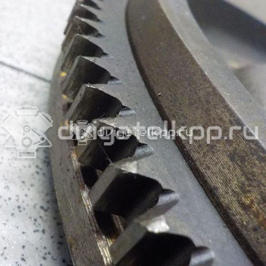 Фото Маховик для двигателя G4EE для Kia Rio / Pride 97 л.с 16V 1.4 л бензин 2320026101