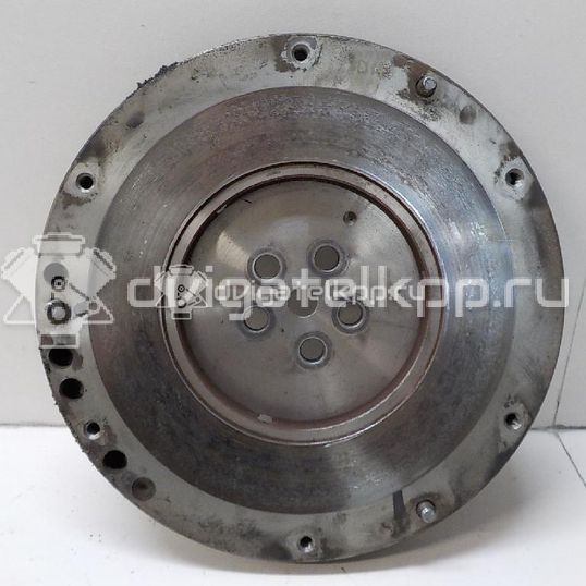 Фото Маховик для двигателя G4EE для Kia Rio / Pride 97 л.с 16V 1.4 л бензин 2320026101
