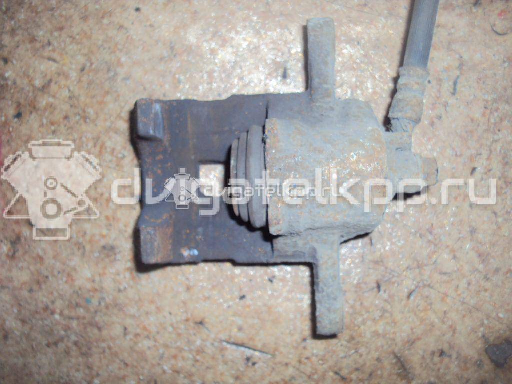 Фото Суппорт тормозной задний левый  582102E300 для Hyundai Tucson {forloop.counter}}