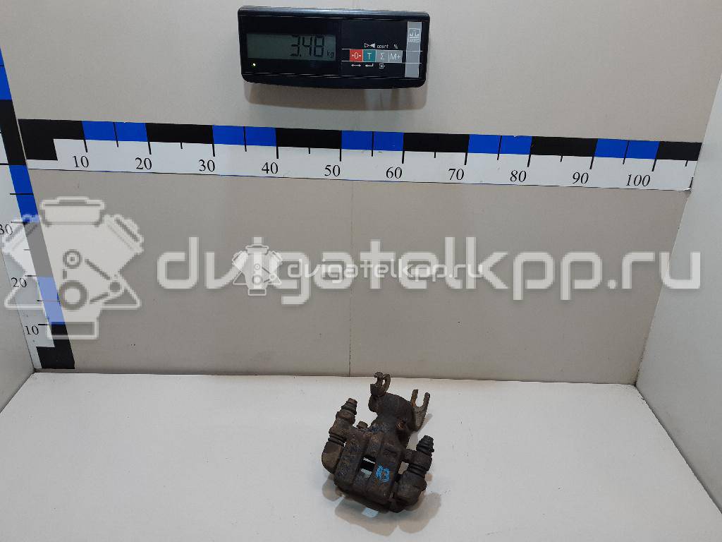 Фото Суппорт тормозной задний правый  0K2N349980 для Kia Shuma Fb / Carens / Sephia Fa / Clarus {forloop.counter}}