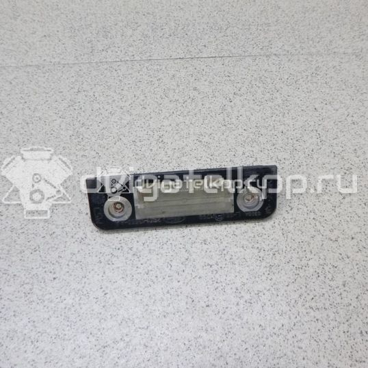 Фото Фонарь подсветки номера  1332916 для Ford Fiesta / Mondeo / Fusion Ju