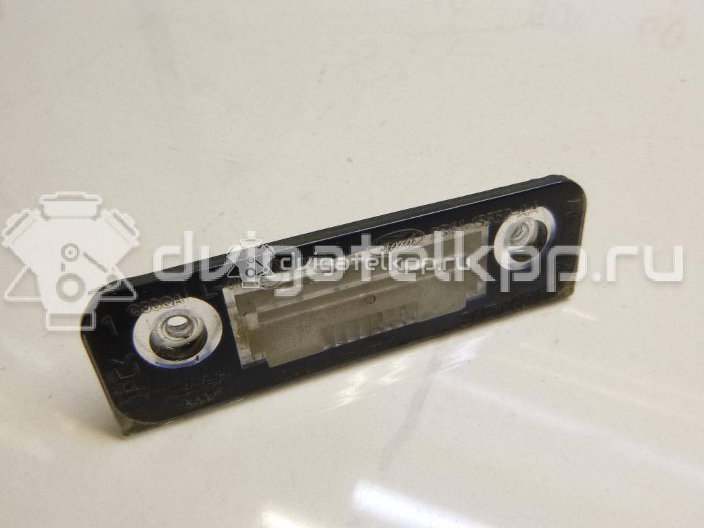 Фото Фонарь подсветки номера  1332916 для Ford Fiesta / Mondeo / Fusion Ju {forloop.counter}}