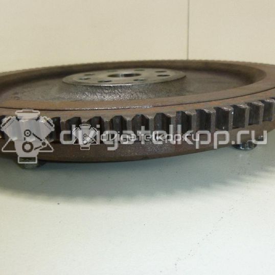 Фото Маховик для двигателя M13A для Suzuki / Chevrolet 82-94 л.с 16V 1.3 л бензин 1262069G01