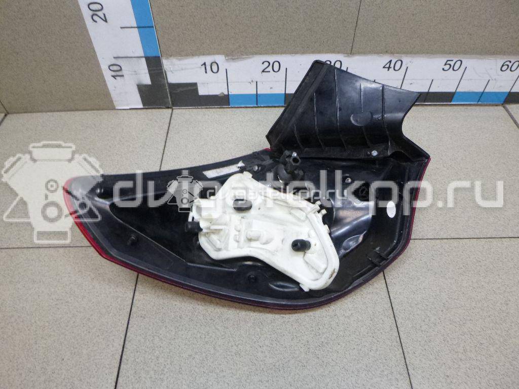 Фото Фонарь задний наружный правый  13319948 для Opel Astra {forloop.counter}}