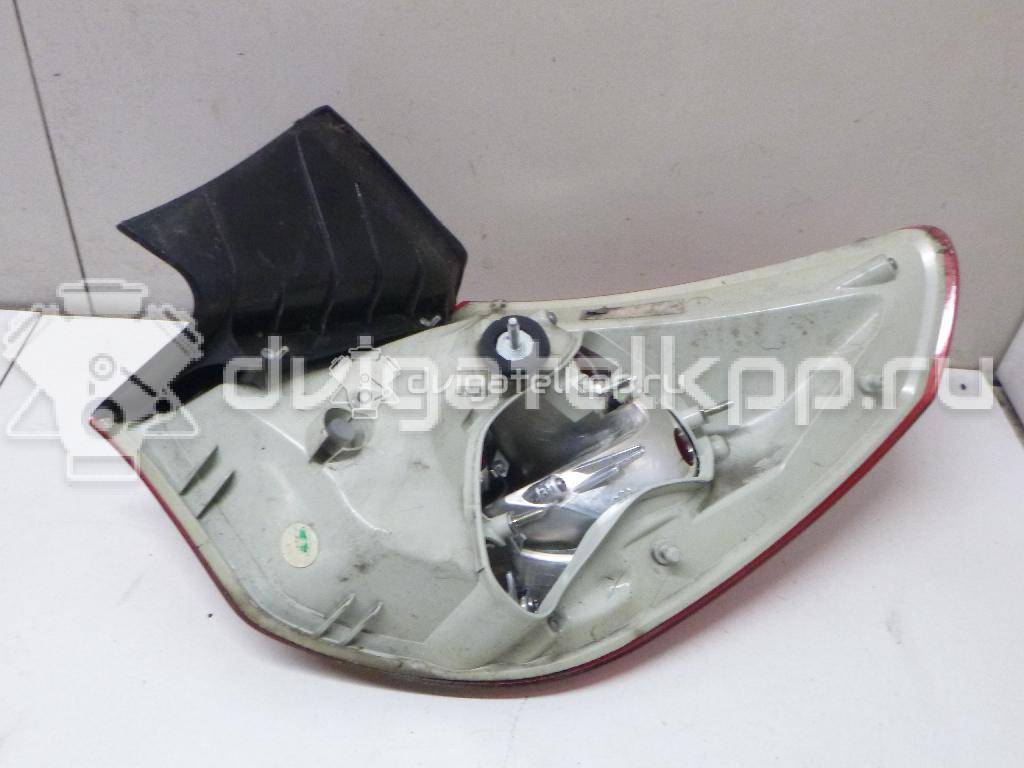 Фото Фонарь задний наружный левый  13306453 для Opel Astra {forloop.counter}}