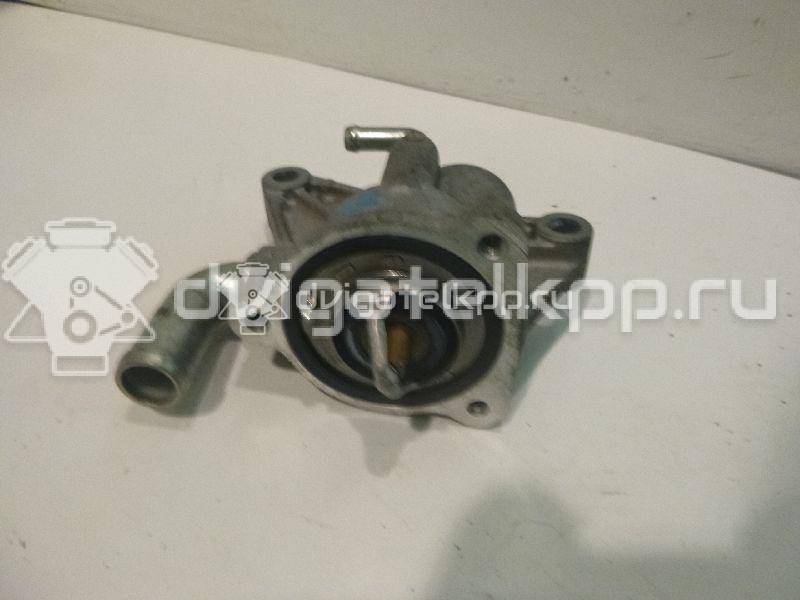 Фото Корпус термостата для двигателя M15A для Subaru / Suzuki / Chevrolet / Holden 99-109 л.с 16V 1.5 л бензин 1769080JA0 {forloop.counter}}
