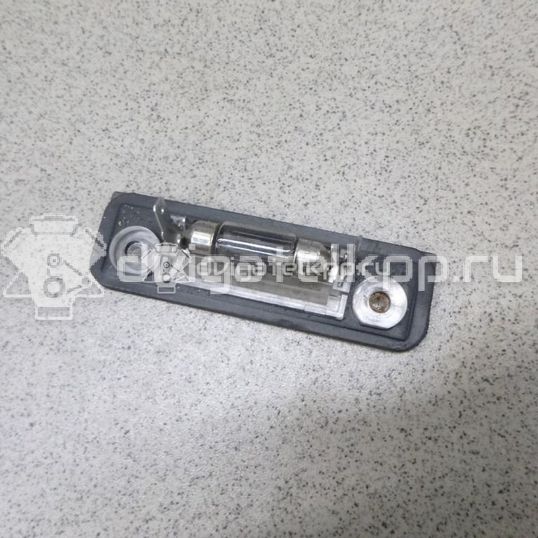 Фото Фонарь подсветки номера  1332916 для Ford Fiesta / Mondeo / Fusion Ju