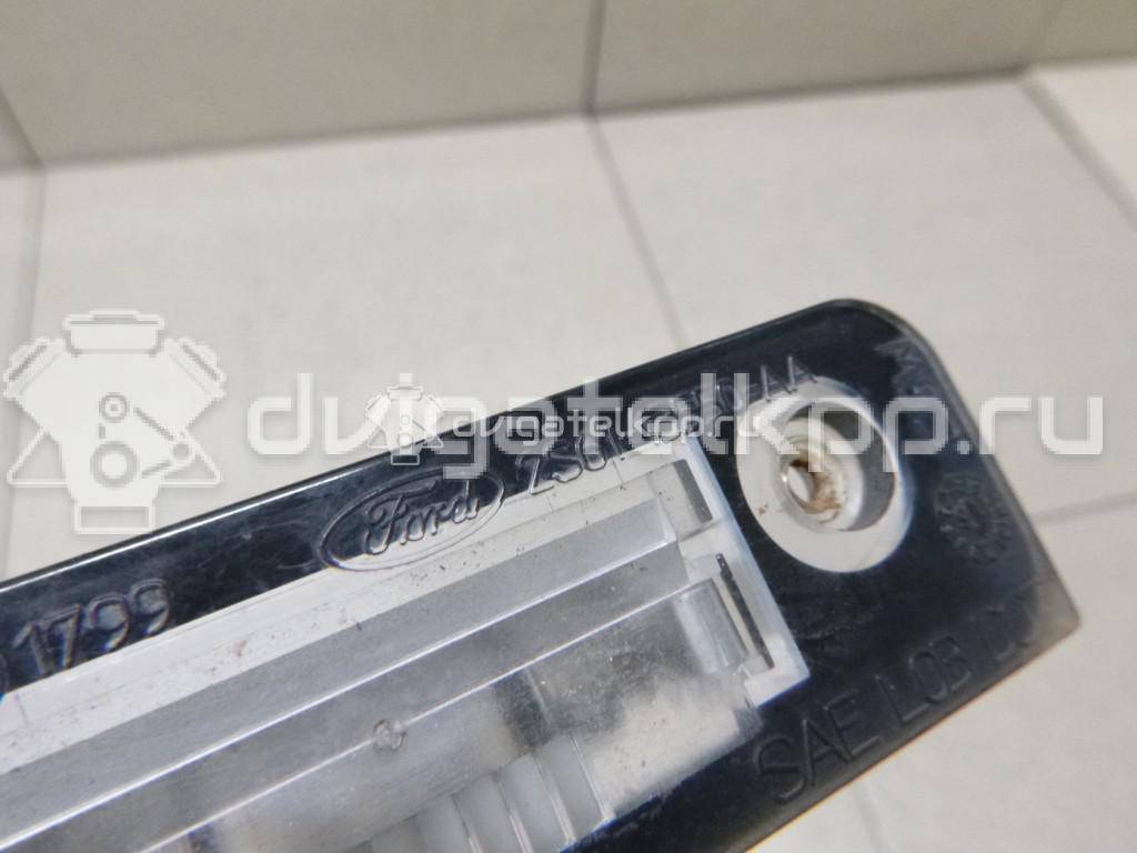 Фото Фонарь подсветки номера  1332916 для Ford Fiesta / Mondeo / Fusion Ju {forloop.counter}}