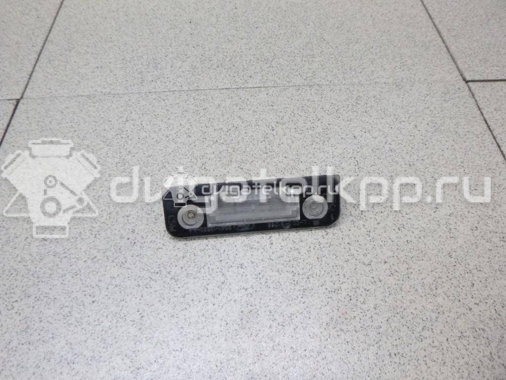 Фото Фонарь подсветки номера  1332916 для Ford Fiesta / Mondeo / Fusion Ju {forloop.counter}}