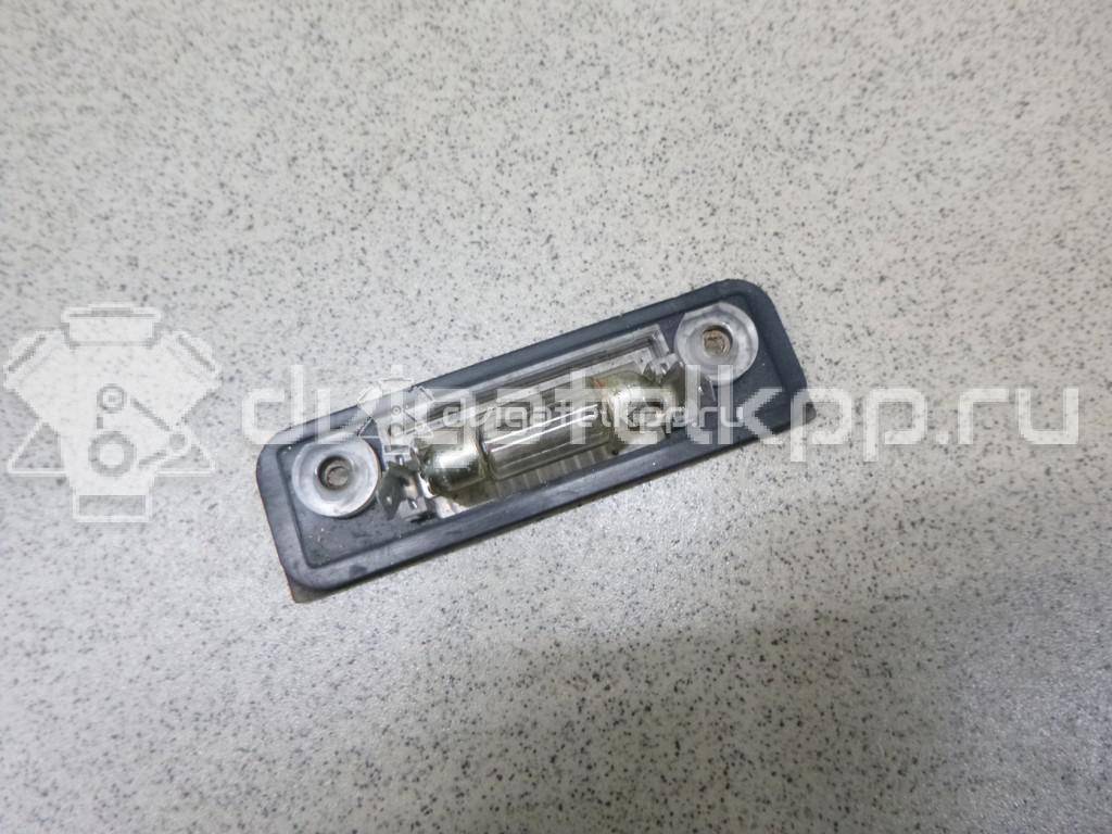 Фото Фонарь подсветки номера  1332916 для Ford Fiesta / Mondeo / Fusion Ju {forloop.counter}}