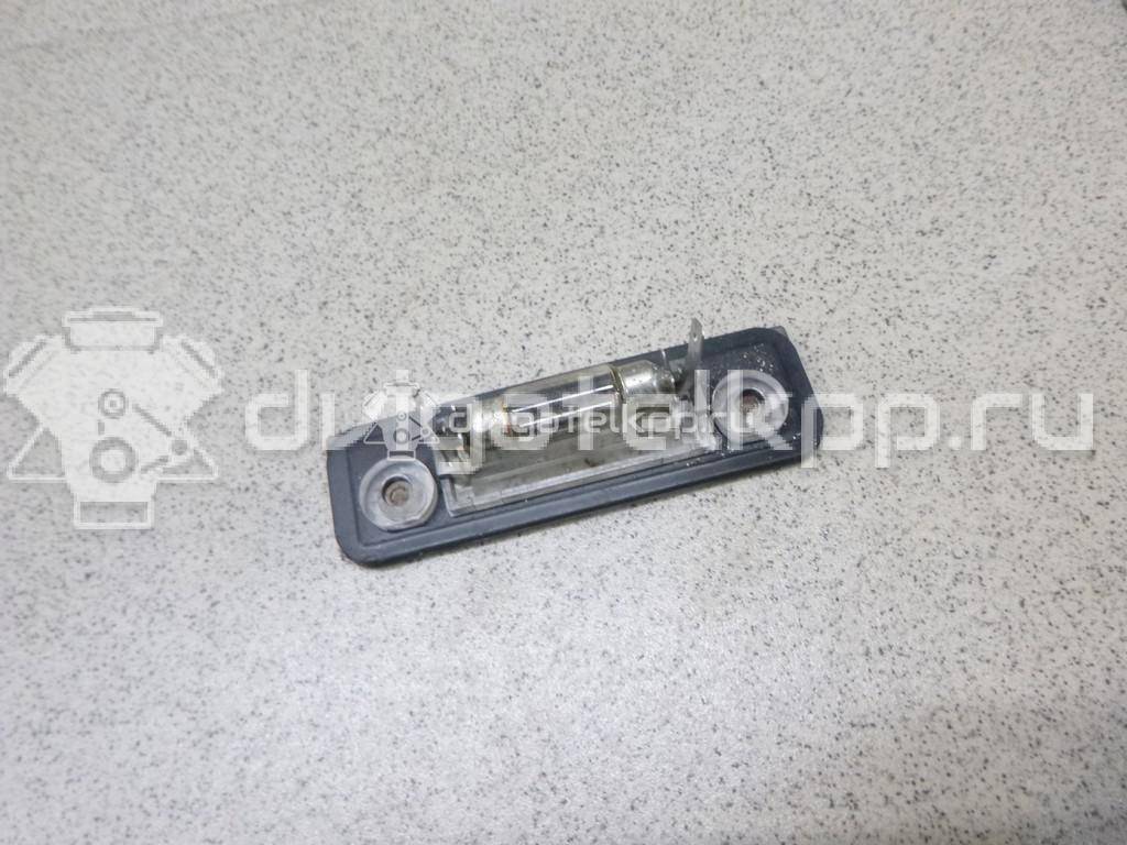 Фото Фонарь подсветки номера  1332916 для Ford Fiesta / Mondeo / Fusion Ju {forloop.counter}}