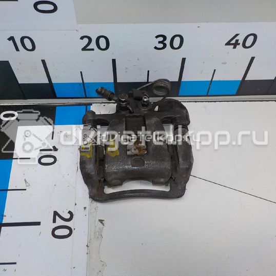 Фото Суппорт тормозной задний правый  584001W350 для Kia Rio