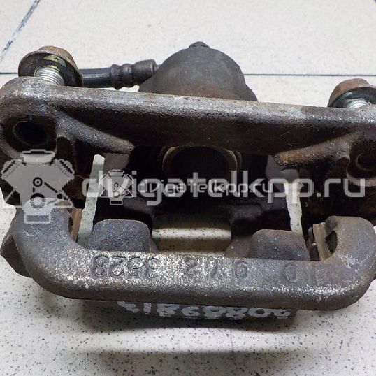 Фото Суппорт тормозной задний левый  440111KD0A для Nissan Tiida / Qashqai / Cube Z12 / Juke F15 / Pulsar C13