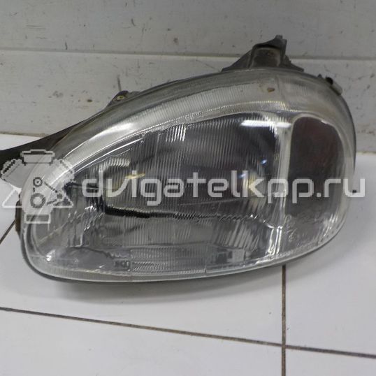 Фото Фара левая  90444786 для Opel Corsa / Combo