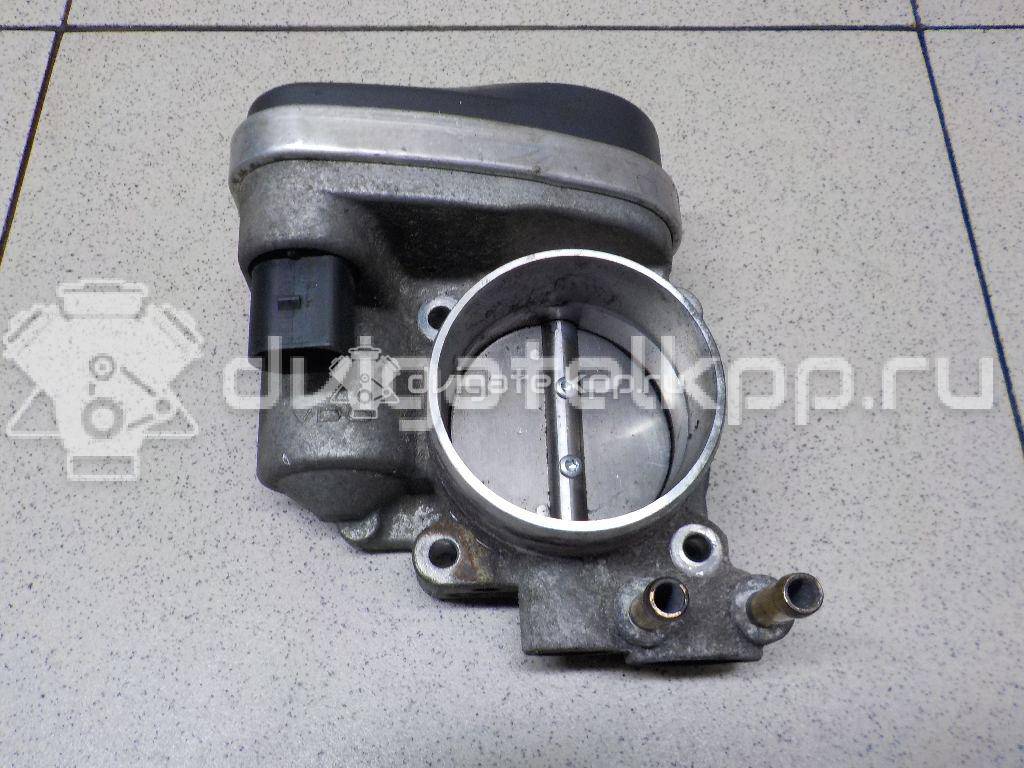 Фото Заслонка дроссельная электрическая  06F133062 для Volkswagen Passat / Touran / Jetta / Golf {forloop.counter}}