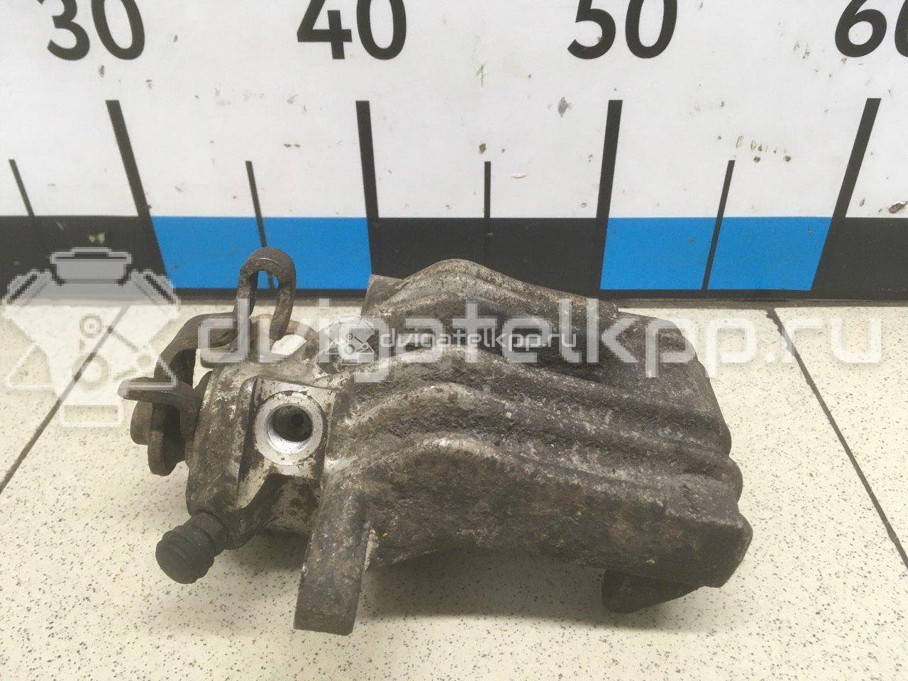 Фото Суппорт тормозной задний левый  6Q0615423A для Volkswagen Polo {forloop.counter}}