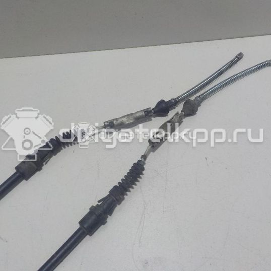 Фото Трос стояночного тормоза  1949912 для Ford Fiesta / B-Max Jk