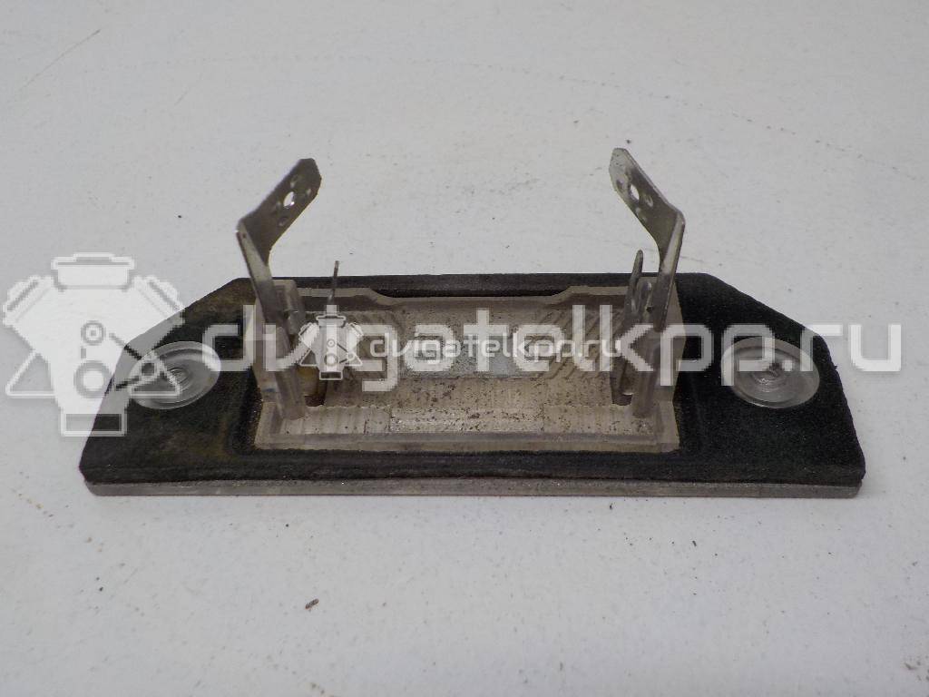 Фото Фонарь подсветки номера  4502331 для Ford Focus / C-Max {forloop.counter}}