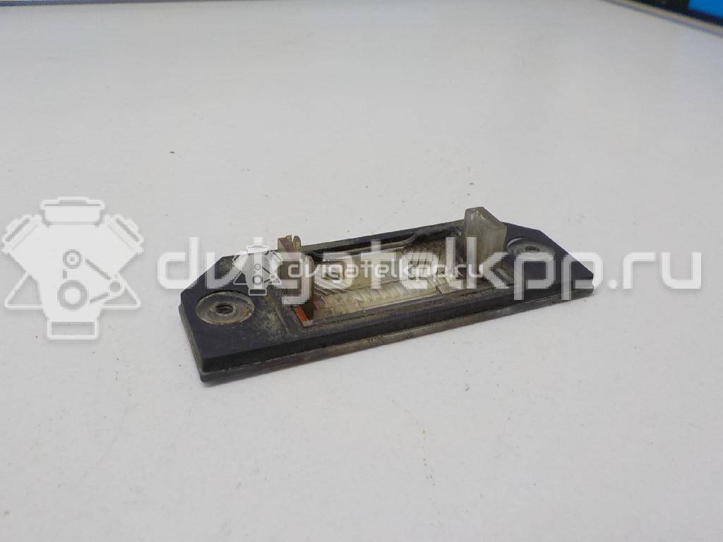 Фото Фонарь подсветки номера  4502331 для Ford Focus / C-Max {forloop.counter}}