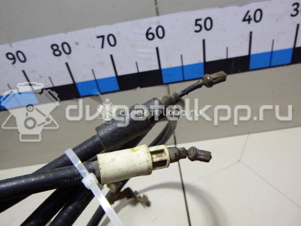 Фото Трос стояночного тормоза  2074151 для Ford Focus / C-Max {forloop.counter}}