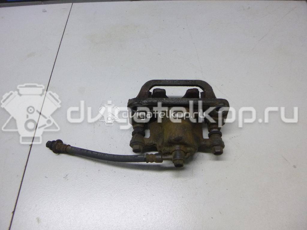 Фото Суппорт тормозной задний правый  440011KD0A для Nissan Tiida / Qashqai / Cube Z12 / Juke F15 / Pulsar C13 {forloop.counter}}