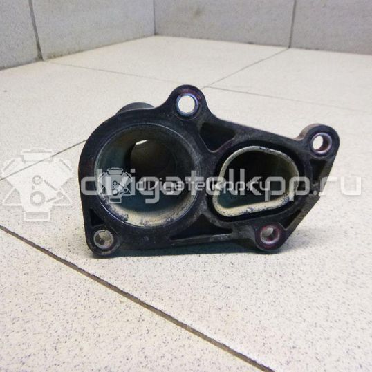 Фото Крышка термостата  1707050 для Ford Fiesta / Focus / C-Max / Ka / Grand