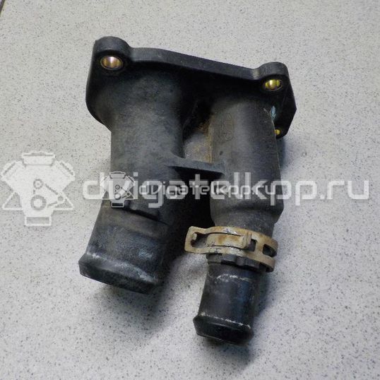 Фото Крышка термостата  1707050 для Ford Fiesta / Focus / C-Max / Ka / Grand