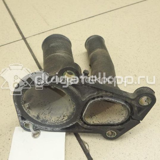 Фото Крышка термостата  1707050 для Ford Fiesta / Focus / C-Max / Ka / Grand