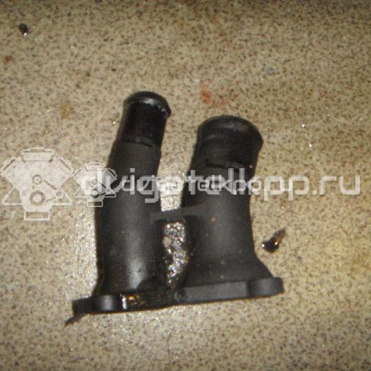 Фото Крышка термостата  1707050 для Ford Fiesta / Focus / C-Max / Ka / Grand