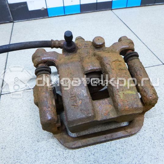 Фото Суппорт тормозной задний левый  44011JY00A для Nissan Qashqai